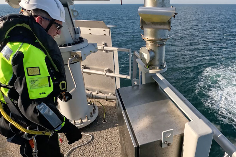 Offshore wind technicians in safety gear at the pilot turbines
